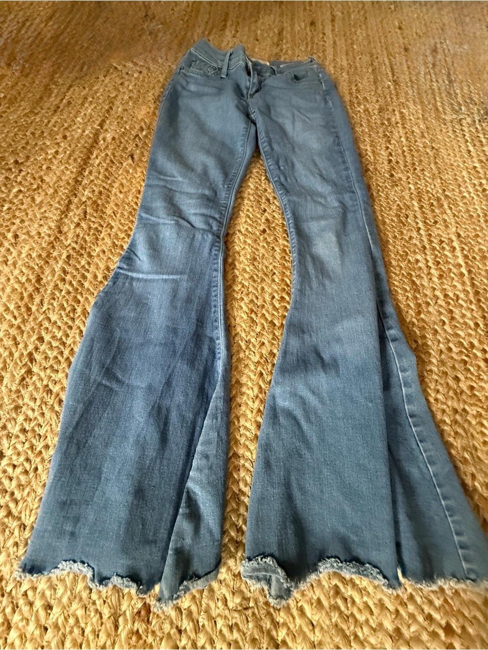 Free People Mid-Blue Flared Jeans with Raw Edge Hem